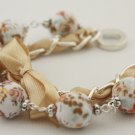 White floral cotton beads and eggshell satin ribbon bracelet