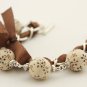 Cream floral cotton beads and brown satin ribbon bracelet