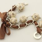 Cream floral cotton beads and brown satin ribbon bracelet