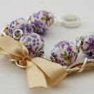 Purple cotton beads and yellow satin ribbon bracelet