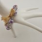Purple cotton beads and yellow satin ribbon bracelet