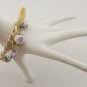 Violet cotton beads and eggshell satin ribbon bracelet