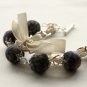 Black floral cotton beads and beige satin ribbon bracelet
