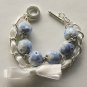 Blue cotton beads and white satin ribbon bracelet