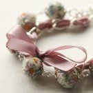 Cream fabric beads and lilac satin ribbon bracelet
