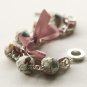 Cream fabric beads and lilac satin ribbon bracelet