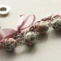 Cream fabric beads and lilac satin ribbon bracelet
