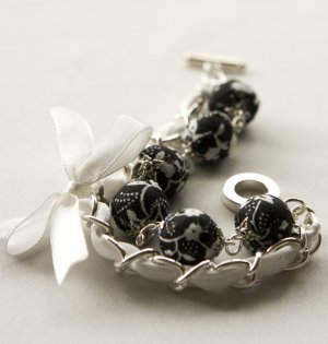 Black fabric beads and white satin ribbon bracelet