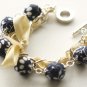 Dark blue fabric beads and yellow satin ribbon bracelet