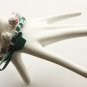White floral fabric beads and emerald satin ribbon bracelet