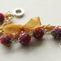 Red cotton beads and yellow satin ribbon bracelet