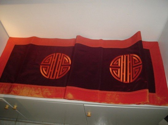 Table runner with emblem embroidery
