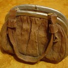 CONCRETE COIN PURSE SCULPTURE WITH A CAN-YOU-FIND-IT PRICE CHALLEGE