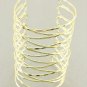 Wire Coil Wrap Armor Cuff Bracelet Designer Style Gold Abstract Avant Garde Statement