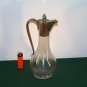 An Antique Silver plated Burgundy Carafe.