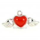 Flying heart charm