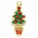 Gold tone christmas tree with red rhinestones