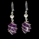 Stone traped in silver plated spiral with amethyst