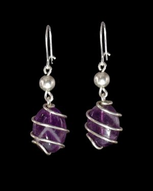 Stone traped in silver plated spiral with amethyst