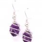 Stone traped in silver plated spiral with amethyst