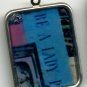 Vintage 1960's "Be a Lady"  Retro Advertisment Pendant