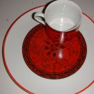 Black and red vintage dessert dishes with teacups
