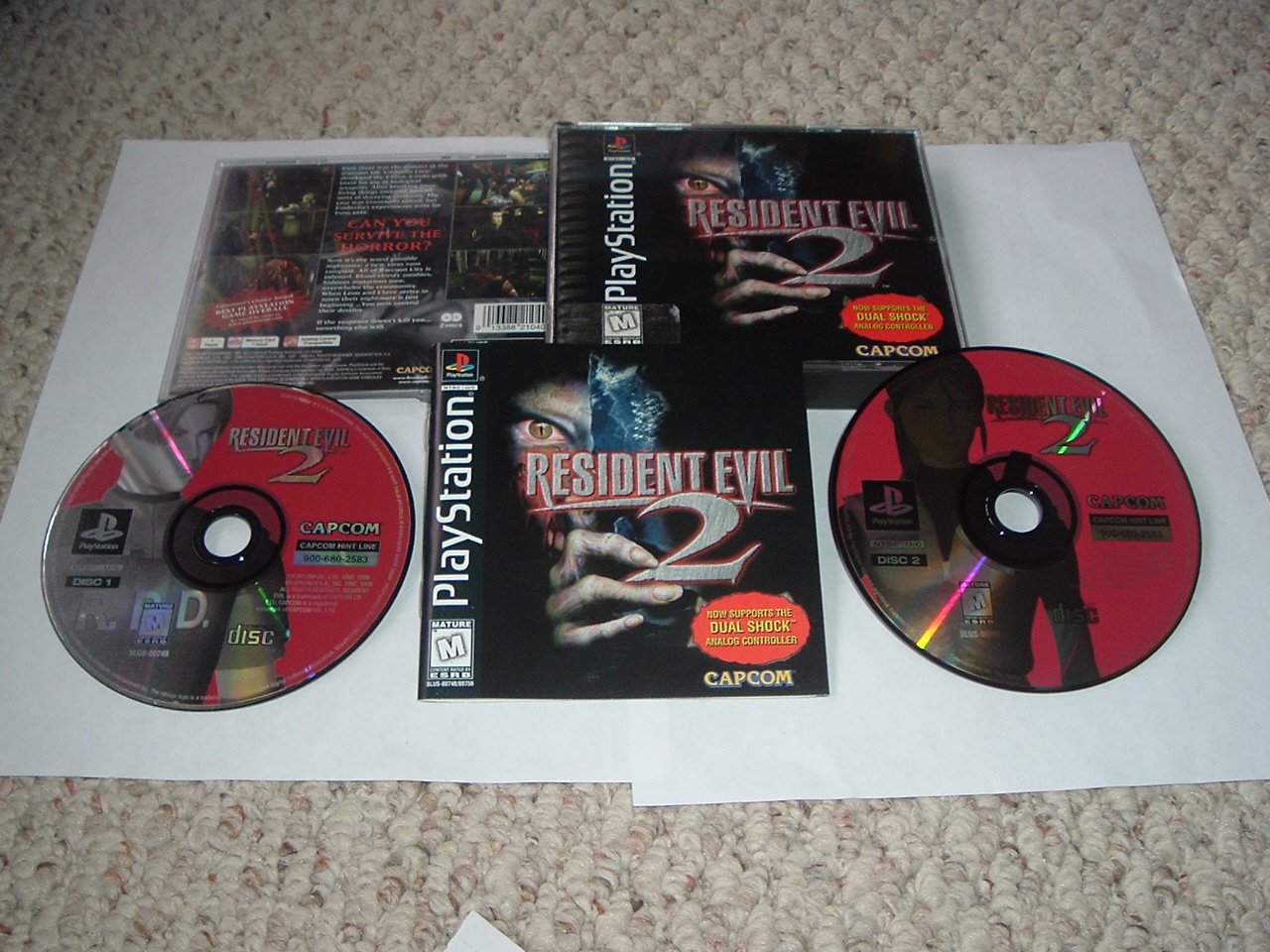 Resident evil dualshock. Resident Evil 2 ps1 Disc. Resident Evil 2 - Dual Shock ps1 обложка. Resident Evil 2 - Dual Shock [Claire] ps1. Resident Evil 2 Dualshock Edition ps1.