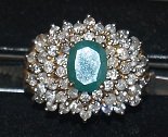 3.94 carat emerald ring surrounded by diamond