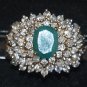 3.94 carat emerald ring surrounded by diamond