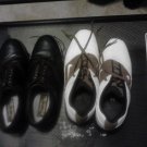 2 pair of golf shoes.