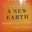 A new earth paperback ex-library copy