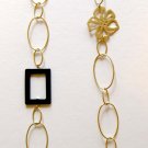 Gold ovals, flowers and black accents trendy fashion necklace