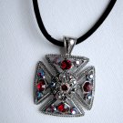 Maltese cross with red crystals