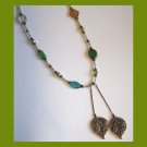 Browns and greens one of a kind fashion necklace with double leaf pendants