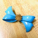 Vintage blue bow with gold center Brooch
