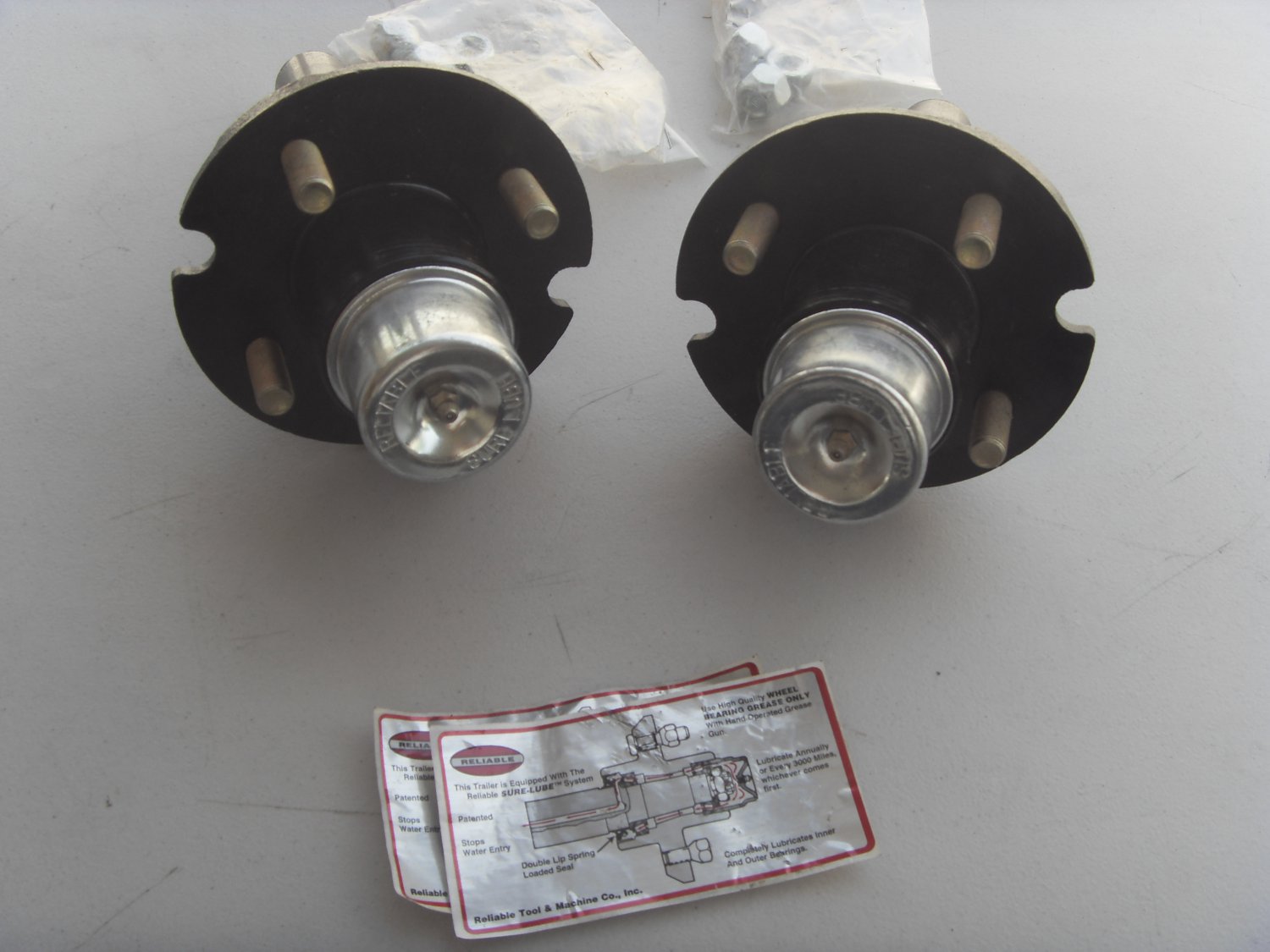 New pair Sure Lube trailer hubs 4 on 4 in.