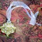 On Key: Vintage-inspired Gold Filigree Medallion White Ribbon Necklace