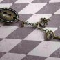 Alice in Wonderland: Down the Rabbit Hole Oval Keyhole Necklace