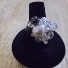 Metal glass pearl in the middle crystals and black beads around ring size 6