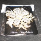 silver/gold pin/brooch