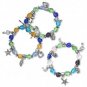 3 Bracelet, glass, multicolored with silver-colored beads and charms, 7-inch stretch.