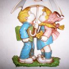 Hummel Boy & Girl Sitting Under Umbrella Wall Hanger BNK2655