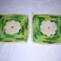 Pair of hand crocheted potholders with rose centers and hanging loops hc1313