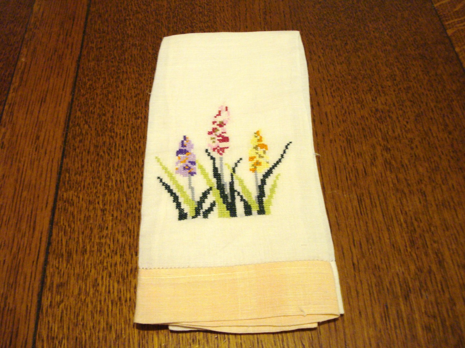 Crossstitch linen guest towel peach border spikey flowers used vintage