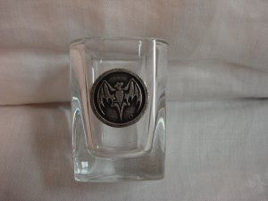Heavy shot glass with pewter bat emblem on side hc3267