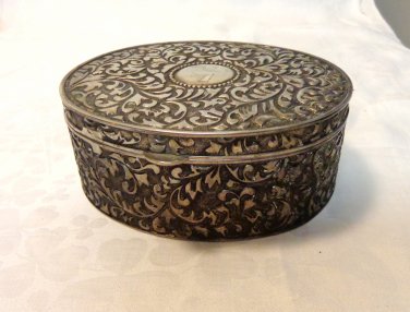 Repousse steel box hinged lid oval silvered interior hc3356