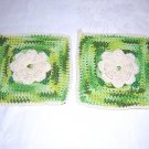 Pair of hand crocheted potholders with rose centers and hanging loops hc1313
