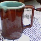 brown glaze cup,mug w/handle htf green inside very neat