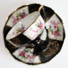 Vintage Porcelain Cup and Saucer, black with flowers