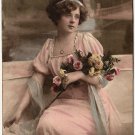 A YOUNG WOMAN WITH ROSES, ANTIQUE 1920'S TINTED POSTCARD WITH LETTER